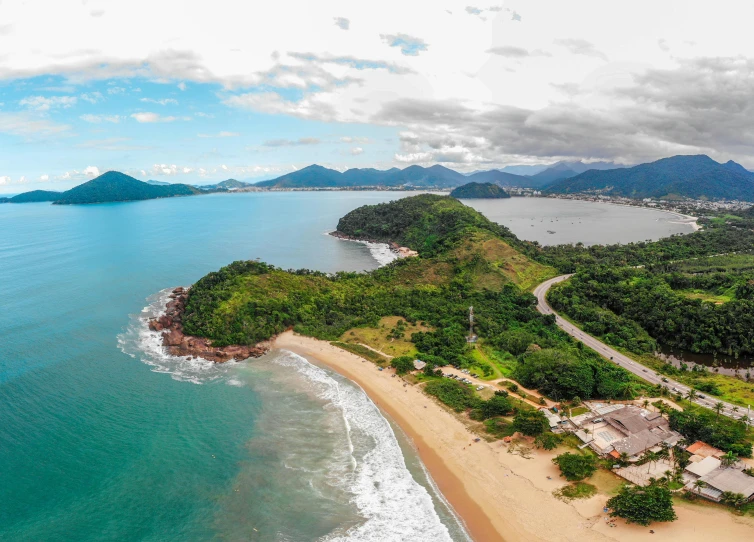 an aerial view of a beach and mountains, by Felipe Seade, travel guide, são paulo, profile image, lush surroundings