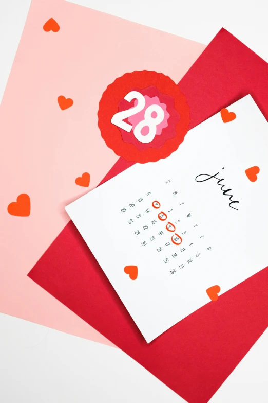 a couple of valentine cards sitting on top of each other, by Julia Pishtar, featured on instagram, female calendar, close-up product photo, papercut, red paint detail