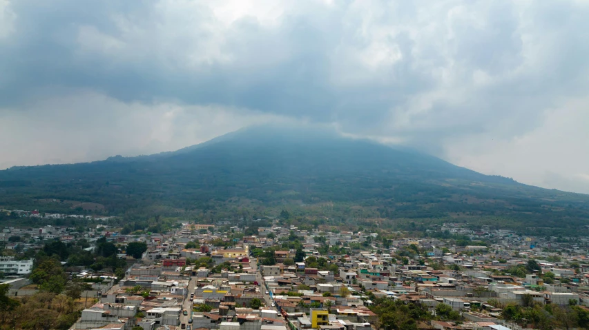 a large hill with a bunch of buildings in the area