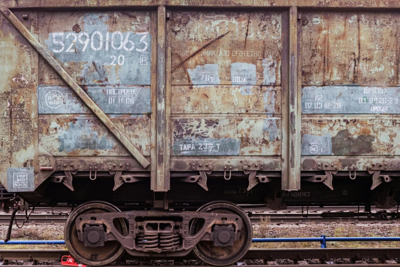 a close up of a train on a train track, by Adam Marczyński, unsplash, graffiti, rusted panels, mine cart, portrait image, super detailed image