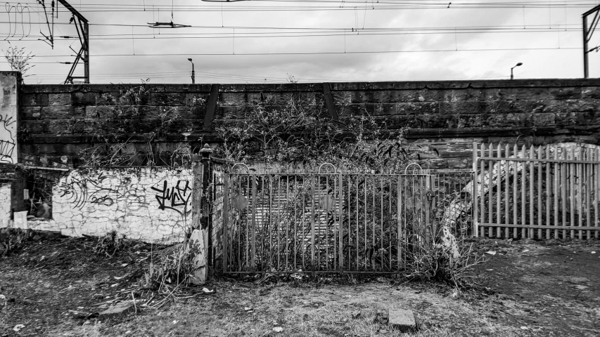 black and white image of a fenced off area