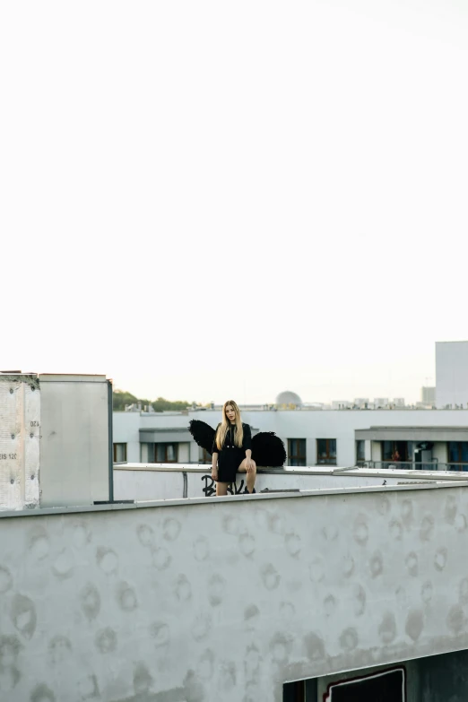 a woman sitting on top of a building, by Niko Henrichon, musician, standing on rooftop, julia hetta, yard