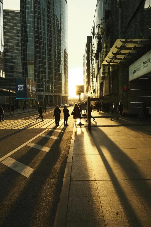 the sun is setting on the horizon in a city