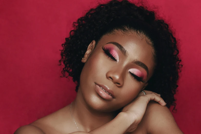 a close up of a person with a red background, an album cover, inspired by Cosmo Alexander, trending on pexels, pastel pink skin tone, sephora, essence, black eyeshadow