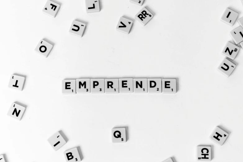 a circle of scrabbles that spell out the word'empreende ', a photo, pexels, business logo, empire, 1 0 0 1, jacqueline e
