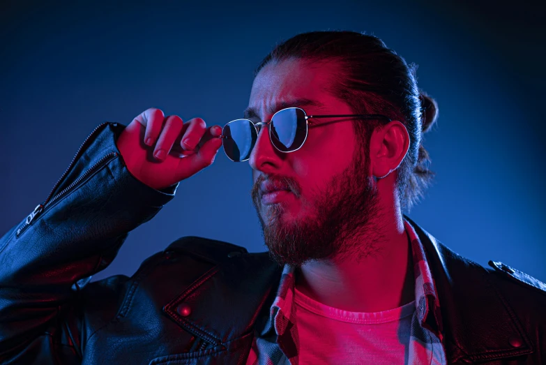 a man wearing a leather jacket and sunglasses, by Matt Cavotta, bursting with blue light, post malone, contemplating, high res