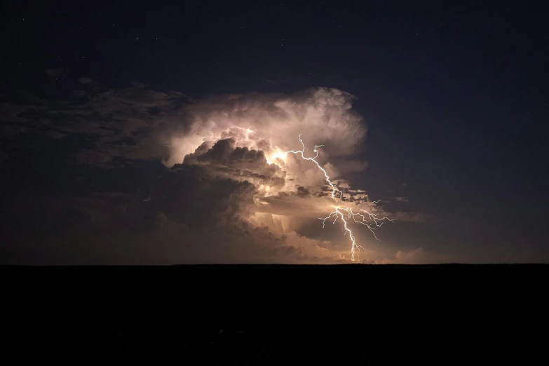 a cloud has just been hit by lightning