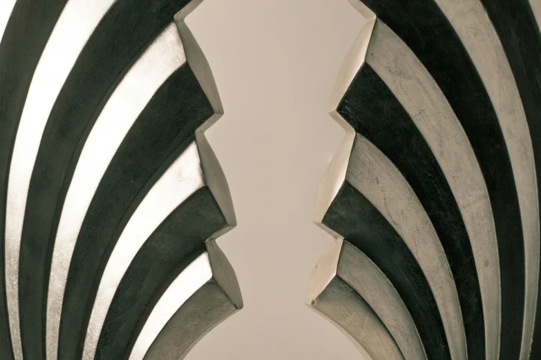 a black and white photo of a spiral design, an abstract sculpture, inspired by Kay Sage, unsplash, op art, detailed sharp metal claws, archway, ashford black marble sculpture, art deco interior
