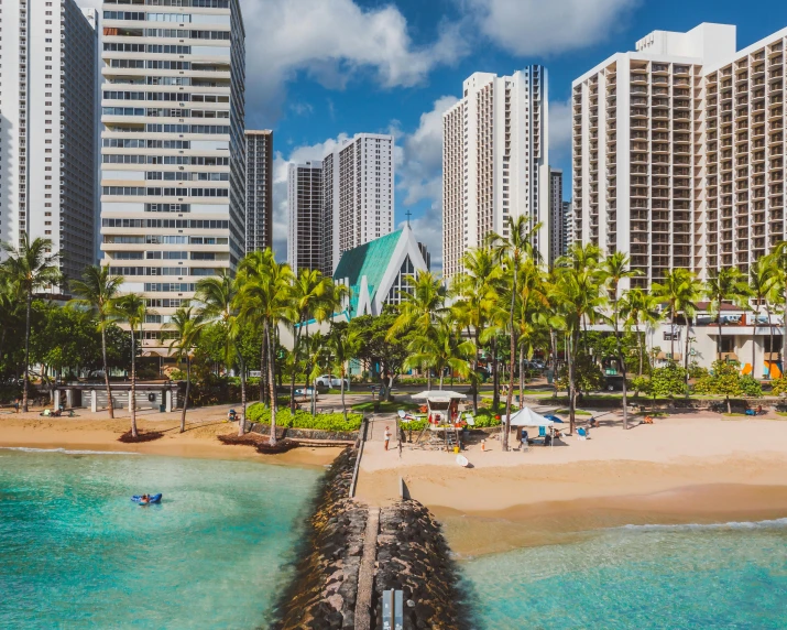 an aerial view of the beach and surrounding el buildings