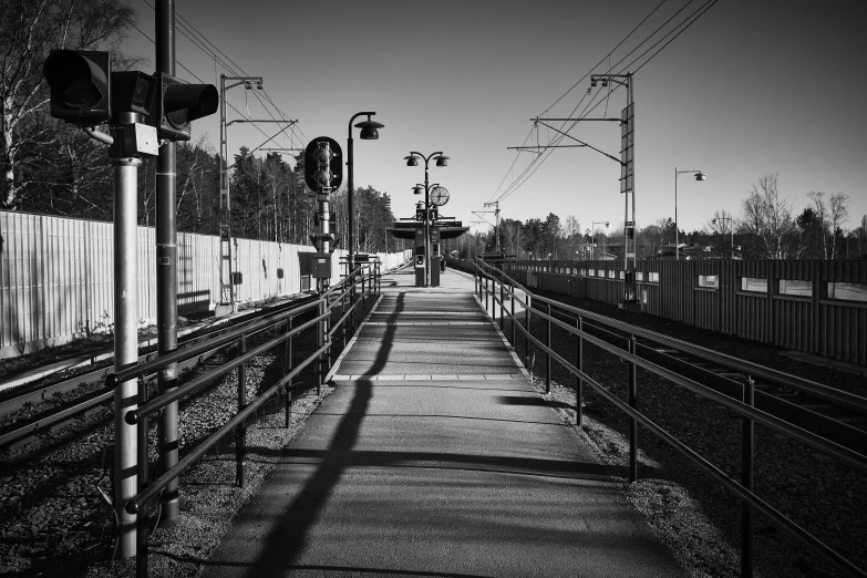 a train sits on a track next to two empty tracks