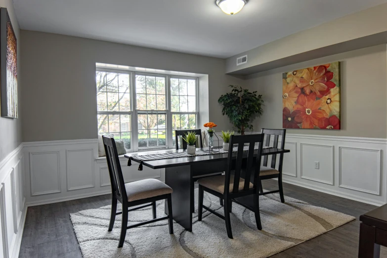 a table and four chairs in a room