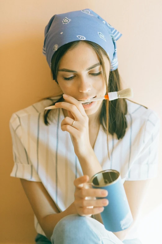 a woman sitting on the floor smoking a cigarette, trending on pexels, hyperrealism, holding a yellow toothbrush, putting makeup on, wearing a headband, breakfast