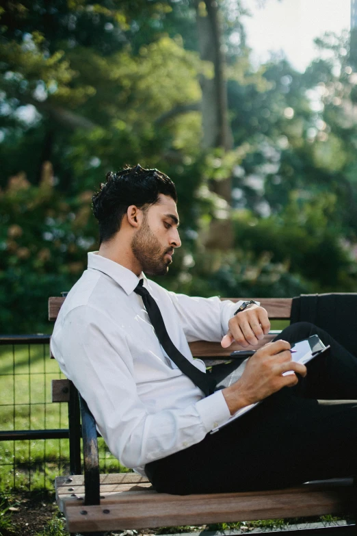 a man sitting on a bench using a laptop, pexels contest winner, dress shirt and tie, holding notebook, sydney park, sleepy