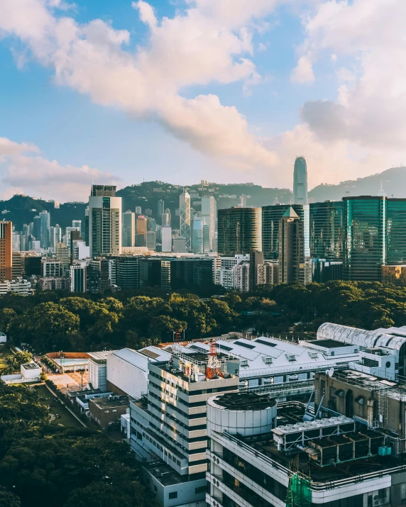 a view of a city from the top of a building, mountains in the background, flatlay, hong kong buildings, trending photo