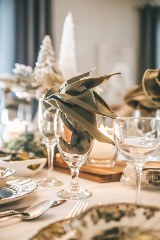 a table topped with glasses filled with food