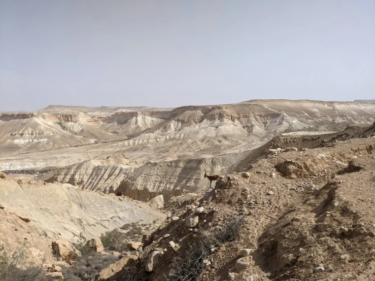 the barren landscape is mostly dry and has mountains and rocks