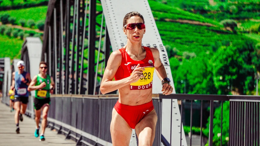 an image of a woman in a bikini running