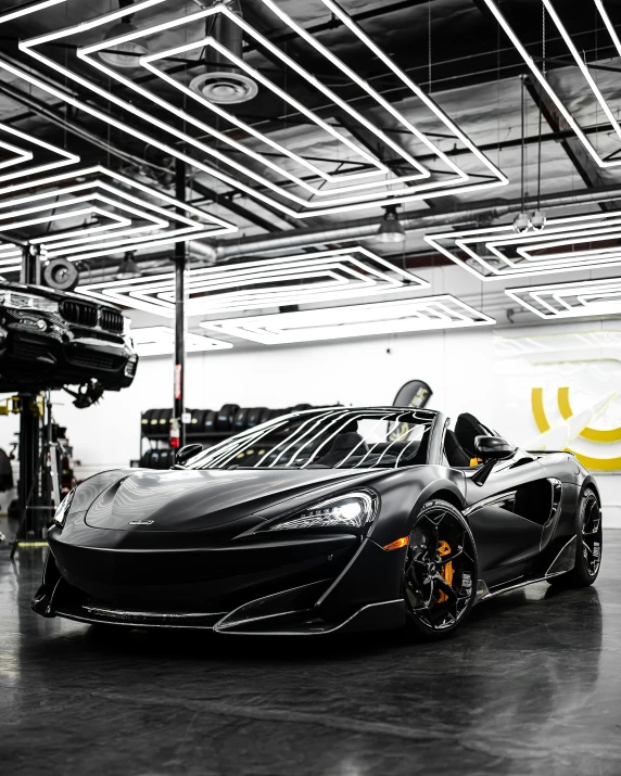 a black sports car parked in a garage, by Anthony Devas, pexels contest winner, renaissance, mclaren, aura jared and wires, samurai vinyl wrap, nvidia octane