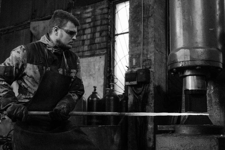 a black and white photo of a man working in a factory, a portrait, by Petr Brandl, pexels contest winner, made of polished broze, 15081959 21121991 01012000 4k, ukrainian, cast glass