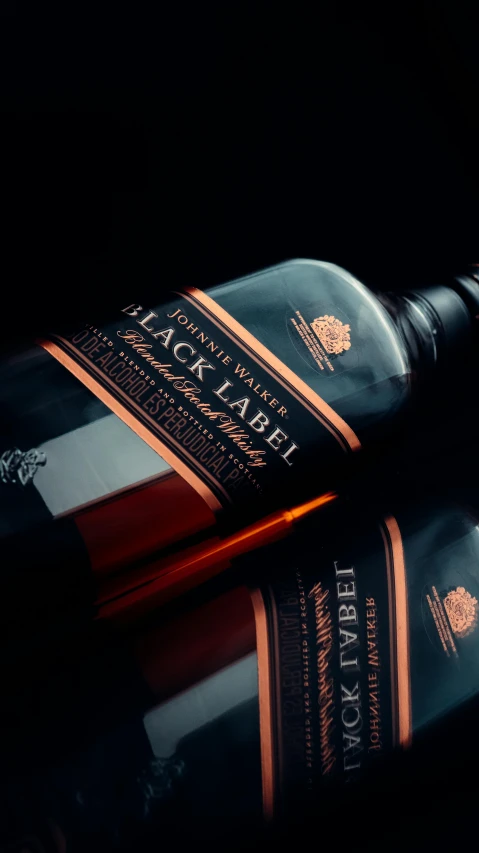 a bottle of whisky sitting on top of a table, a digital rendering, pexels contest winner, les nabis, black on black, beautiful labels, black and orange, zoomed in shots