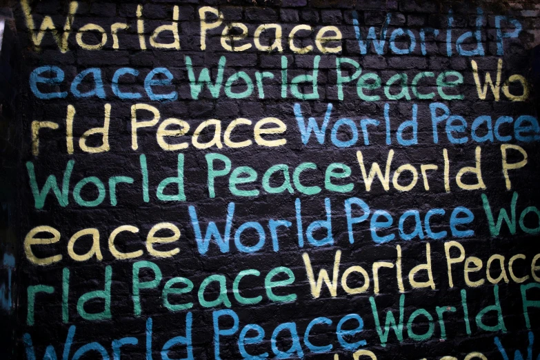 the word peace painted on a brick wall, an album cover, by Sam Dillemans, pixabay, avatar image, blackboard, united nations, terence mckenna