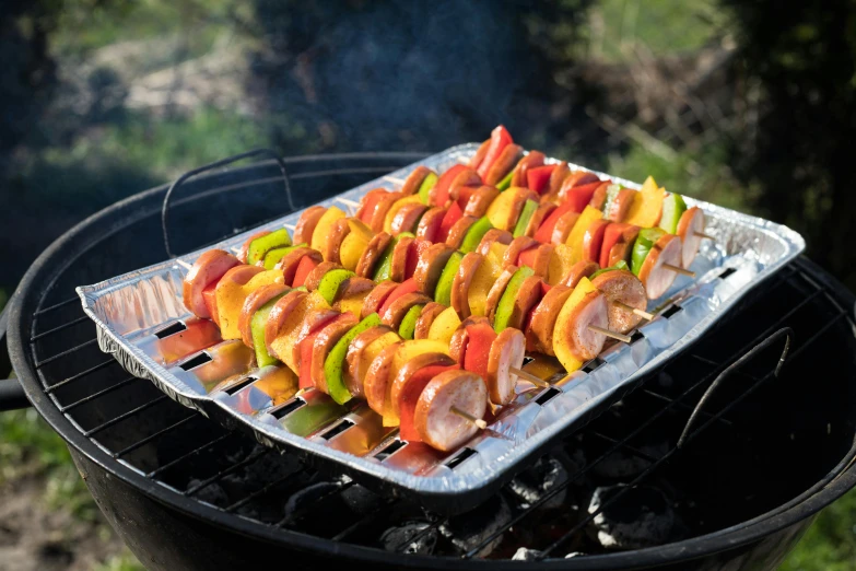 a close up of a tray of food on a grill, dau-al-set, fire punch, multi colour, peach, unbeatable quality