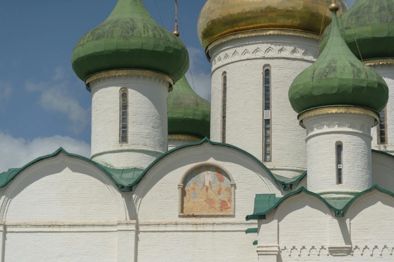 a large white building with green domes on top of it, an album cover, inspired by Konstantin Vasilyev, unsplash, cloisonnism, brown, archs, 000 — википедия, square