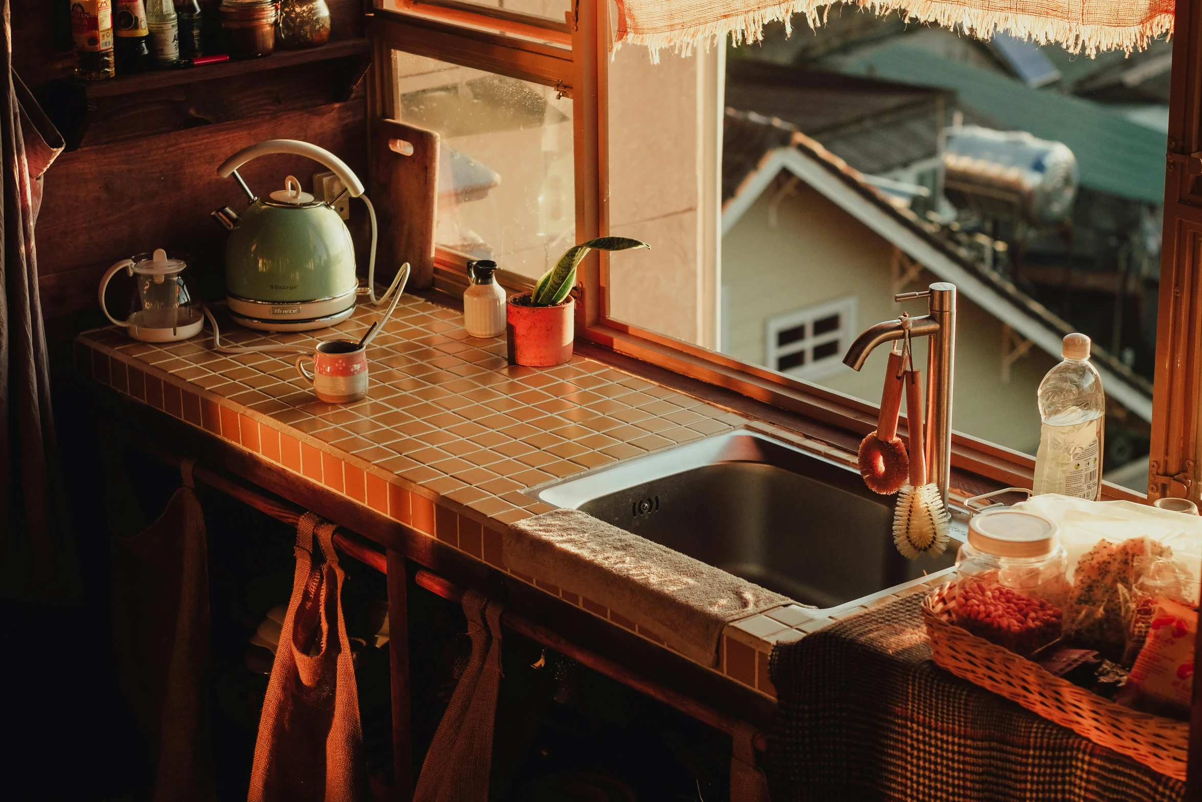 a kitchen that has a small sink and wooden counter