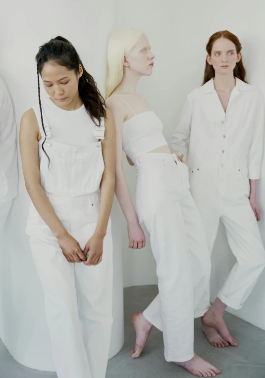 a group of women standing next to each other, inspired by Vanessa Beecroft, trending on unsplash, gutai group, wearing overalls, all white render, for a catalogue, loosely cropped