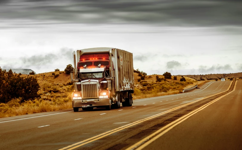 a semi truck driving down the road on a cloudy day, a portrait, shutterstock, mixed art, historical, multi-part, thumbnail