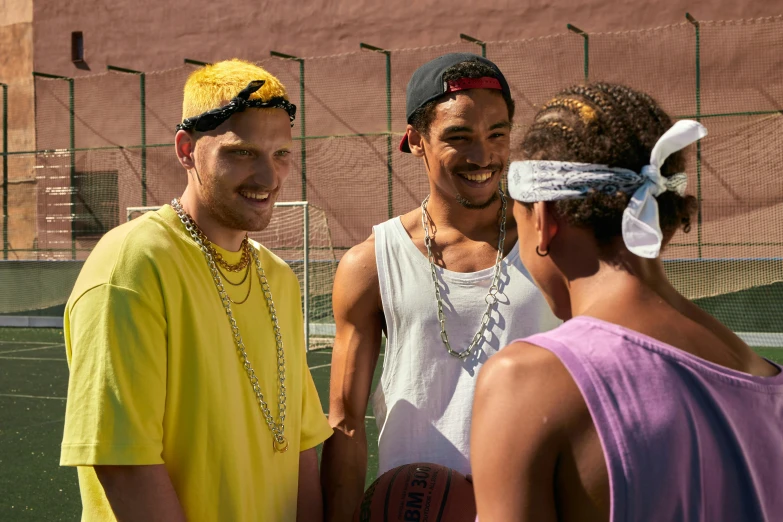 four people in an enclosed tennis court on the tennis court