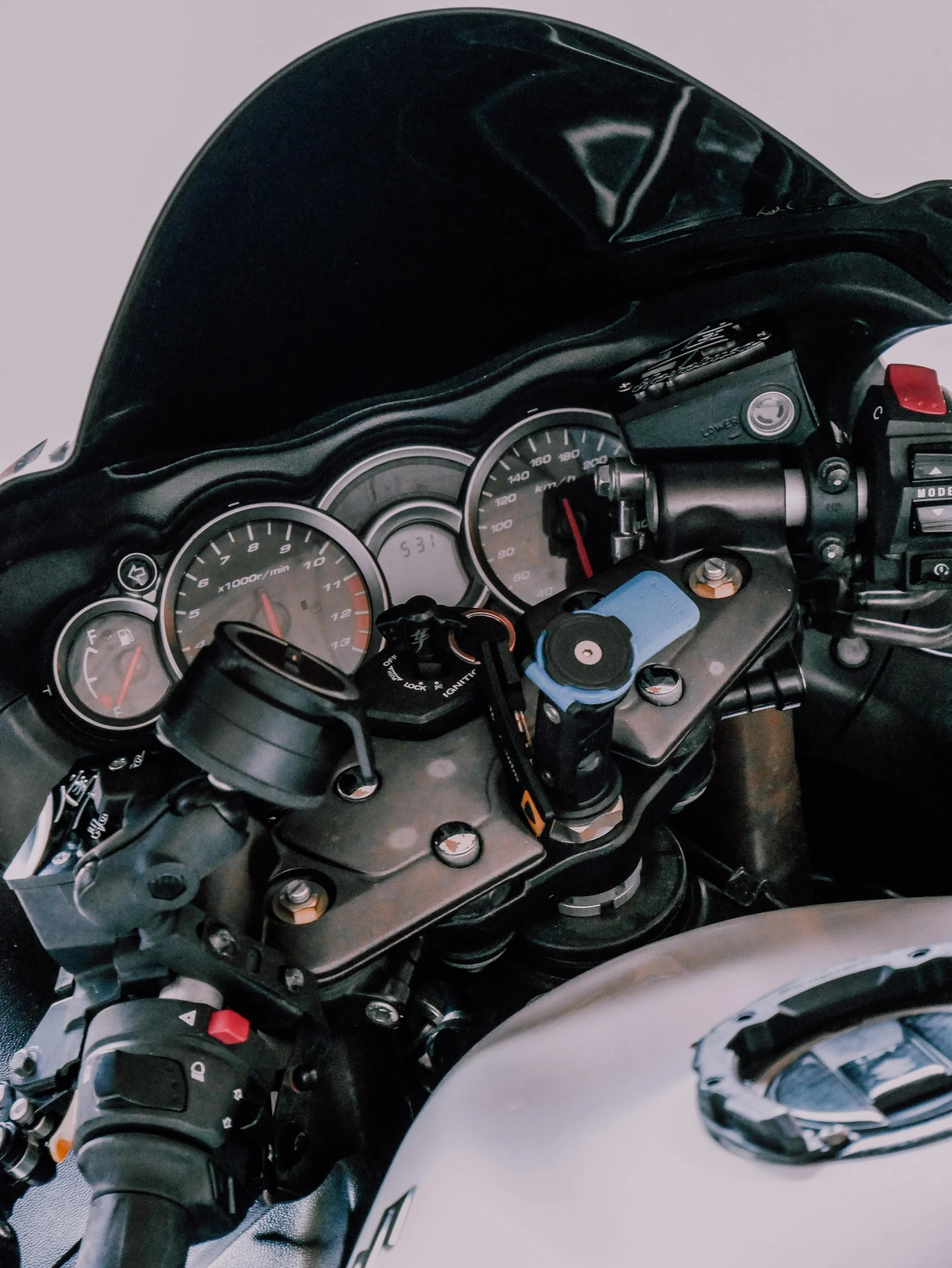 a close up of the dashboard of a motorcycle, a portrait, unsplash, process art, leaking pistons, panoramic, taken on iphone 14 pro, black