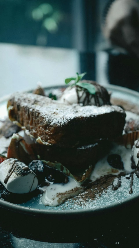 a close up of a plate of food on a table, by Nick Fudge, unsplash, romanticism, smothered in melted chocolate, toast, low quality photo, thumbnail