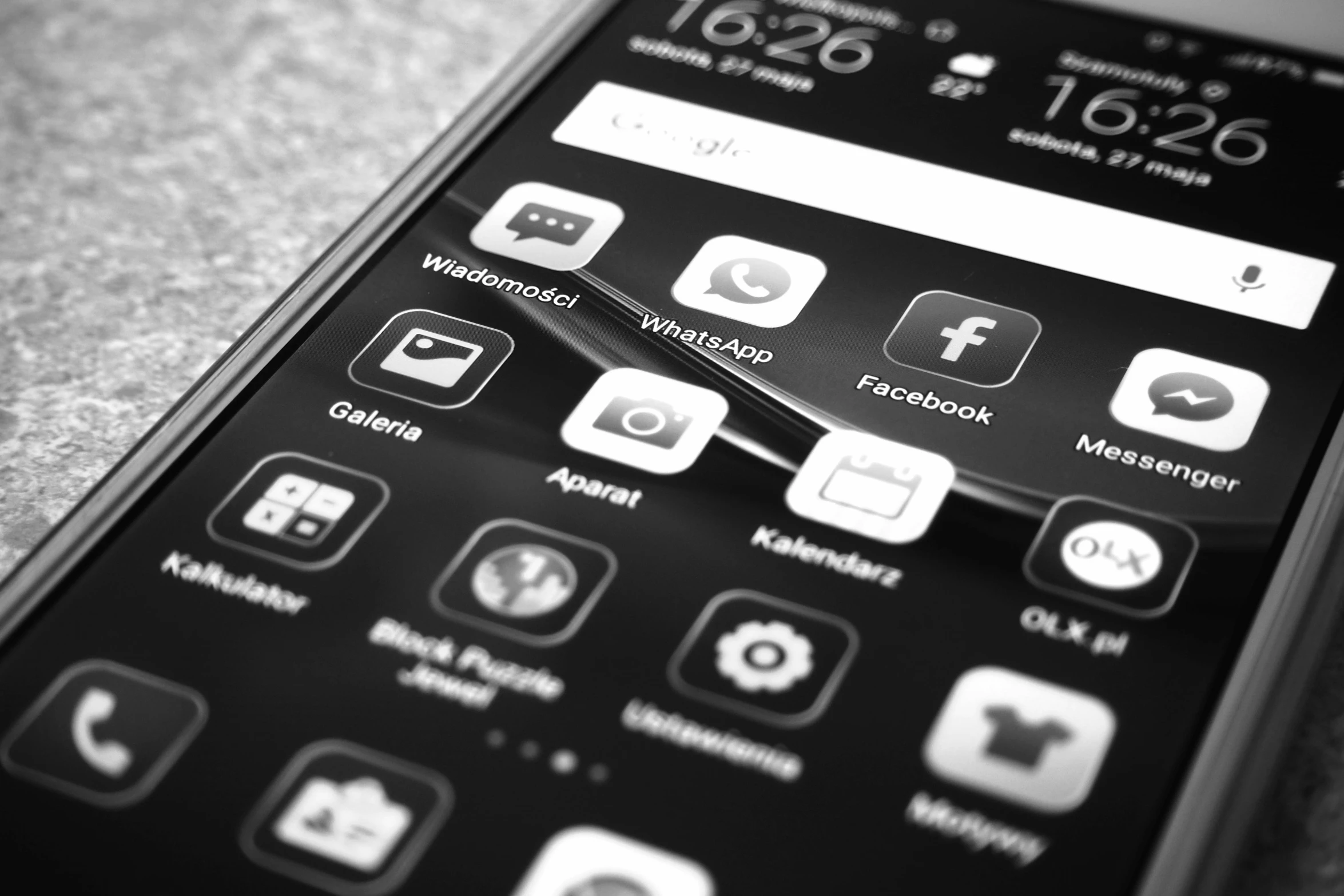 a close up of a cell phone on a table, a black and white photo, by Daniel Lieske, pexels, icon pack, black interface, android, facebook photo