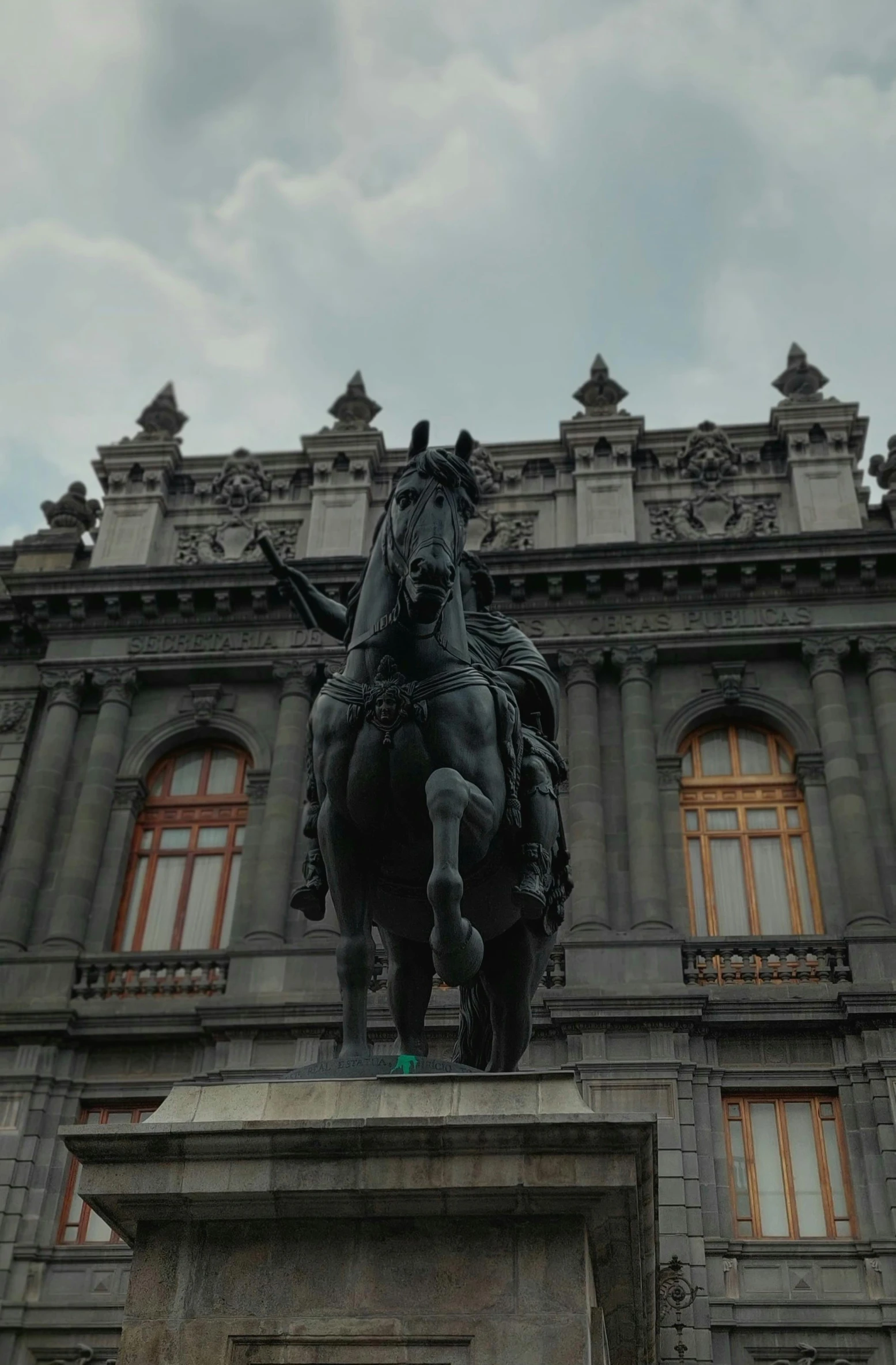 a statue of a man on a horse in front of a building, inspired by Agustín Fernández, rococo, dome, up-close, sculpture!!, opening scene