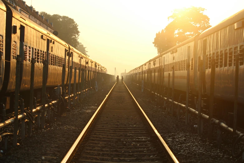 a couple of trains that are sitting on the tracks, pexels contest winner, full morning sun, rectangle, instagram picture, soft golden light