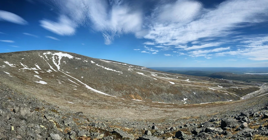 a group of mountains and clouds in the sky