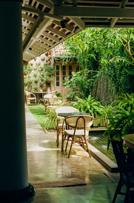 a chair and table on a patio in a yard