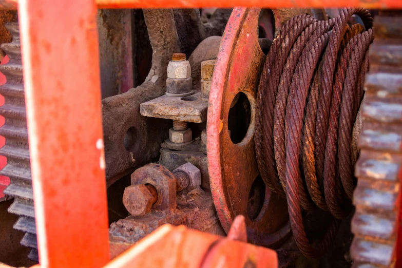 a close up of a close up of a machine, by David Simpson, pexels, square jaw-line, ropes, a photograph of a rusty, a brightly colored