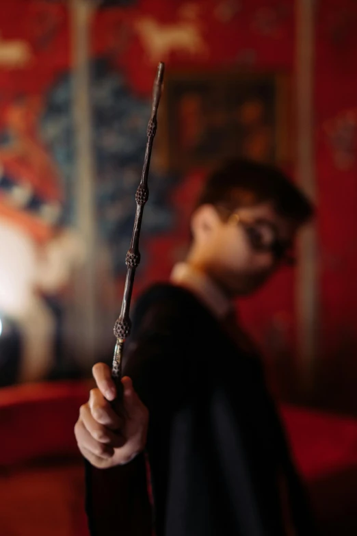 a close up of a person holding a wand, a picture, movie still, large)}], indoor picture, mischief managed