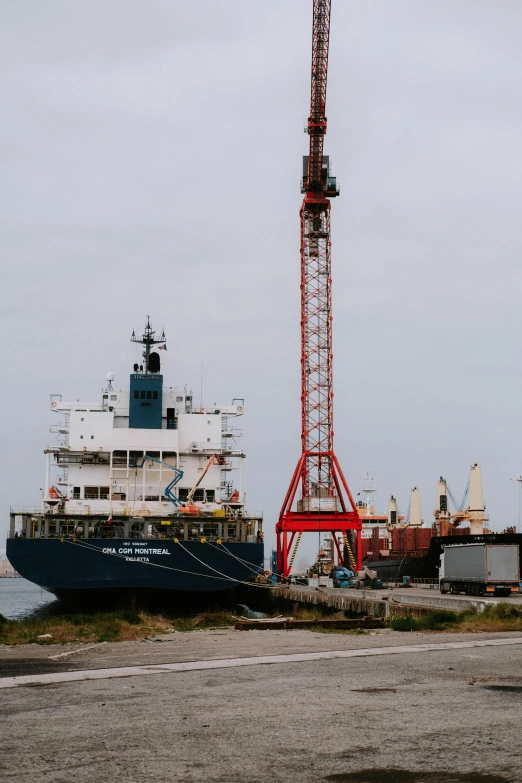 a large boat sitting on top of a body of water, by Joe Stefanelli, shipping docks, black sea, geology, three masts