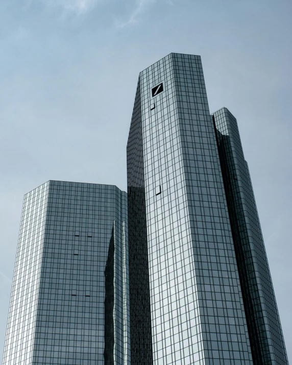 a couple of tall buildings sitting next to each other, inspired by David Chipperfield, pexels contest winner, bauhaus, thumbnail, german, commercial photo, multiple stories