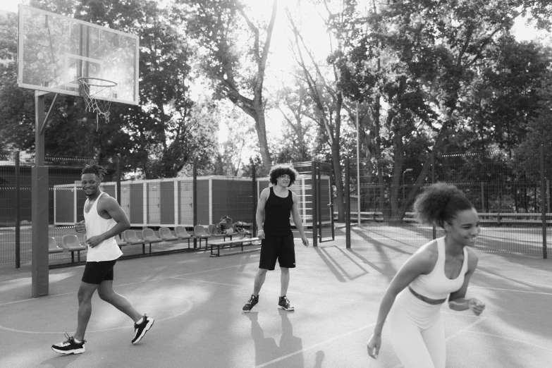 a group of people playing a game of basketball, a black and white photo, by Emma Andijewska, curly afro, summer afternoon, working out, aleksander rostov