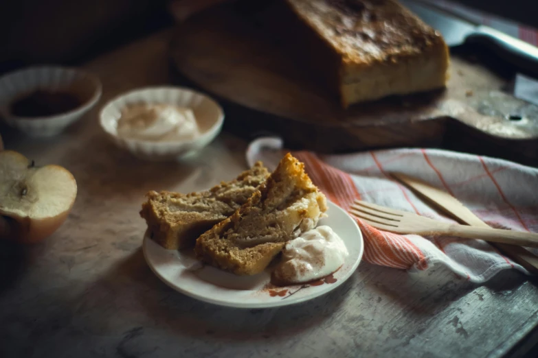 a loaf of bread sitting on top of a white plate, a still life, by Lee Loughridge, unsplash, whipped cream on top, with bread in the slots, cake, a blond