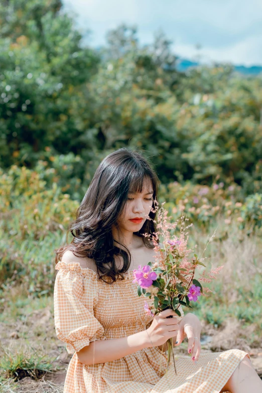 a woman sitting in a field holding a bunch of flowers, by Tan Ting-pho, unsplash, realism, ulzzang, ((portrait)), avatar image, small