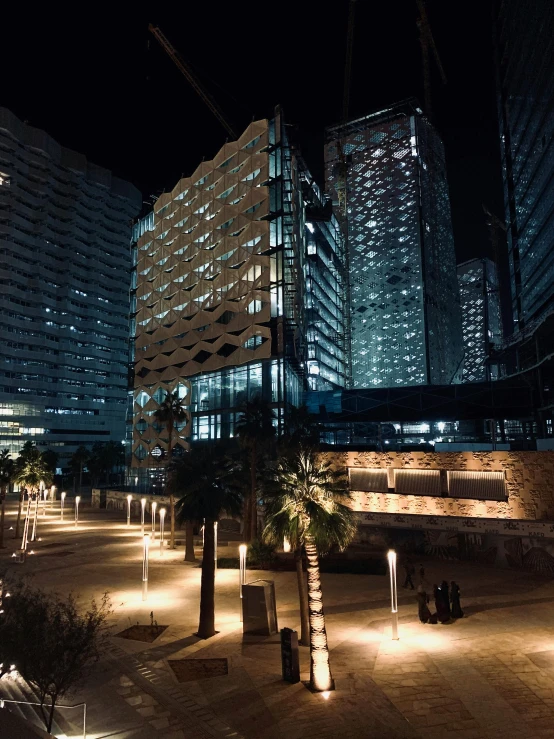 lights shine through the darkness on a city street at night