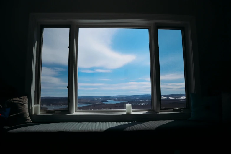 a window is shown with the view of a landscape out of it