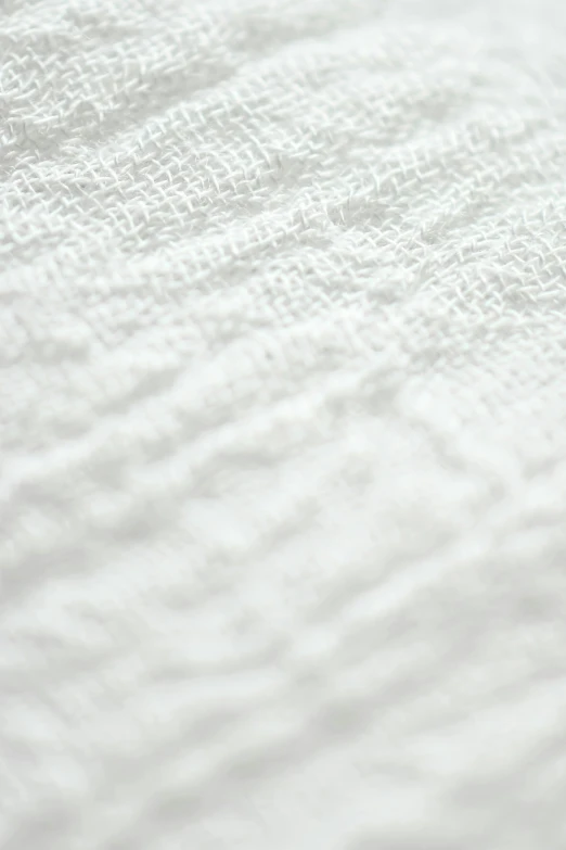 a close up of a white towel on a bed, by Adam Marczyński, white: 0.5, wet fabric, white, semi-transparent