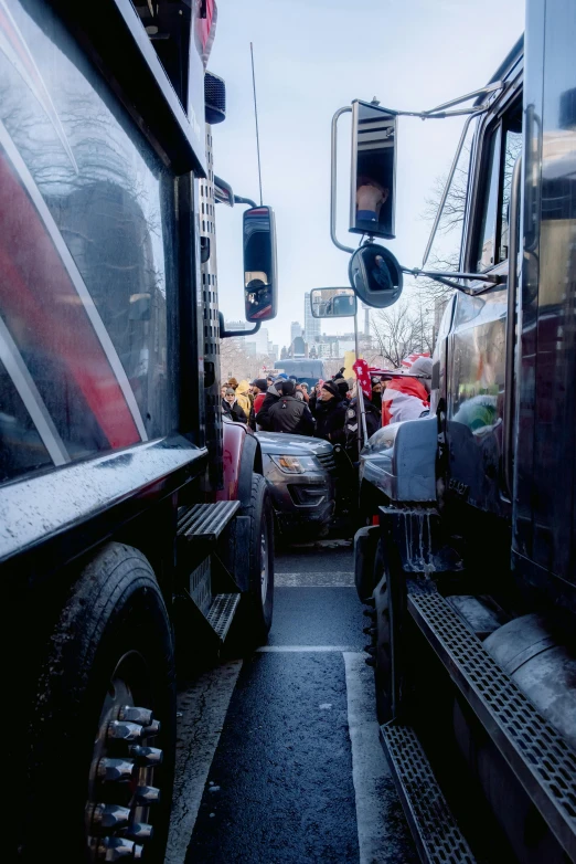 a truck driver and another person look in their truck