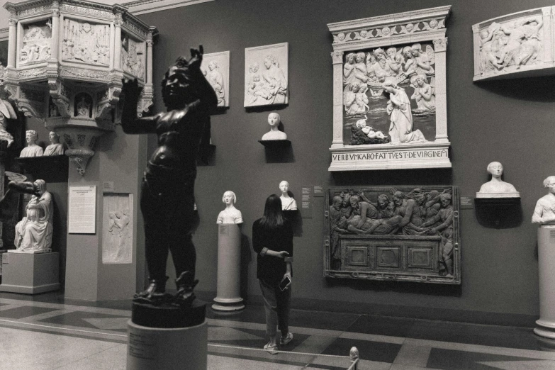 a black and white photo of a museum, a statue, inspired by Andrea del Verrocchio, instagram, academic art, a person standing in front of a, met collection, neogothic art, having a good time